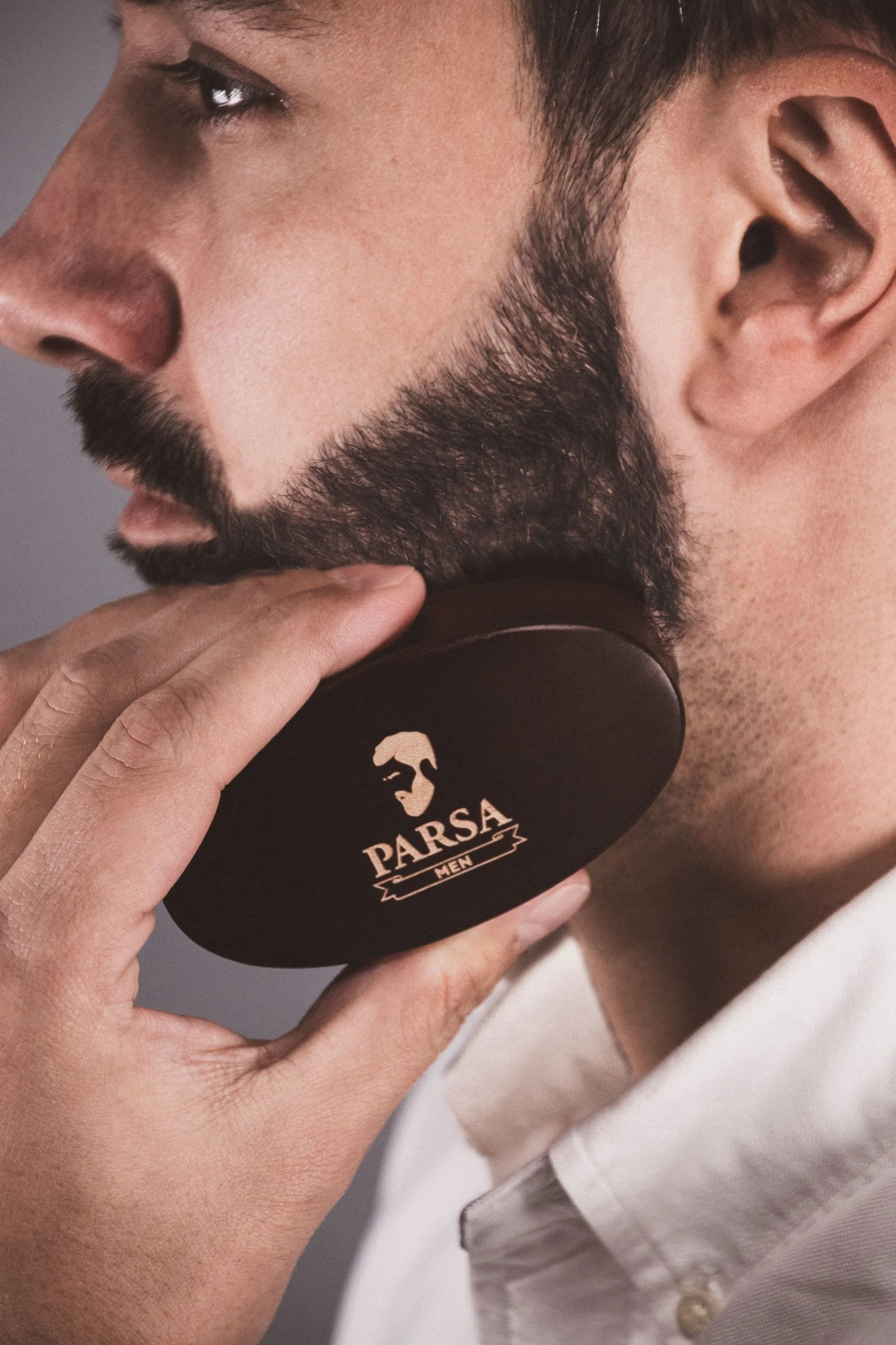 Model using Parsa Beauty Beard Grooming Set