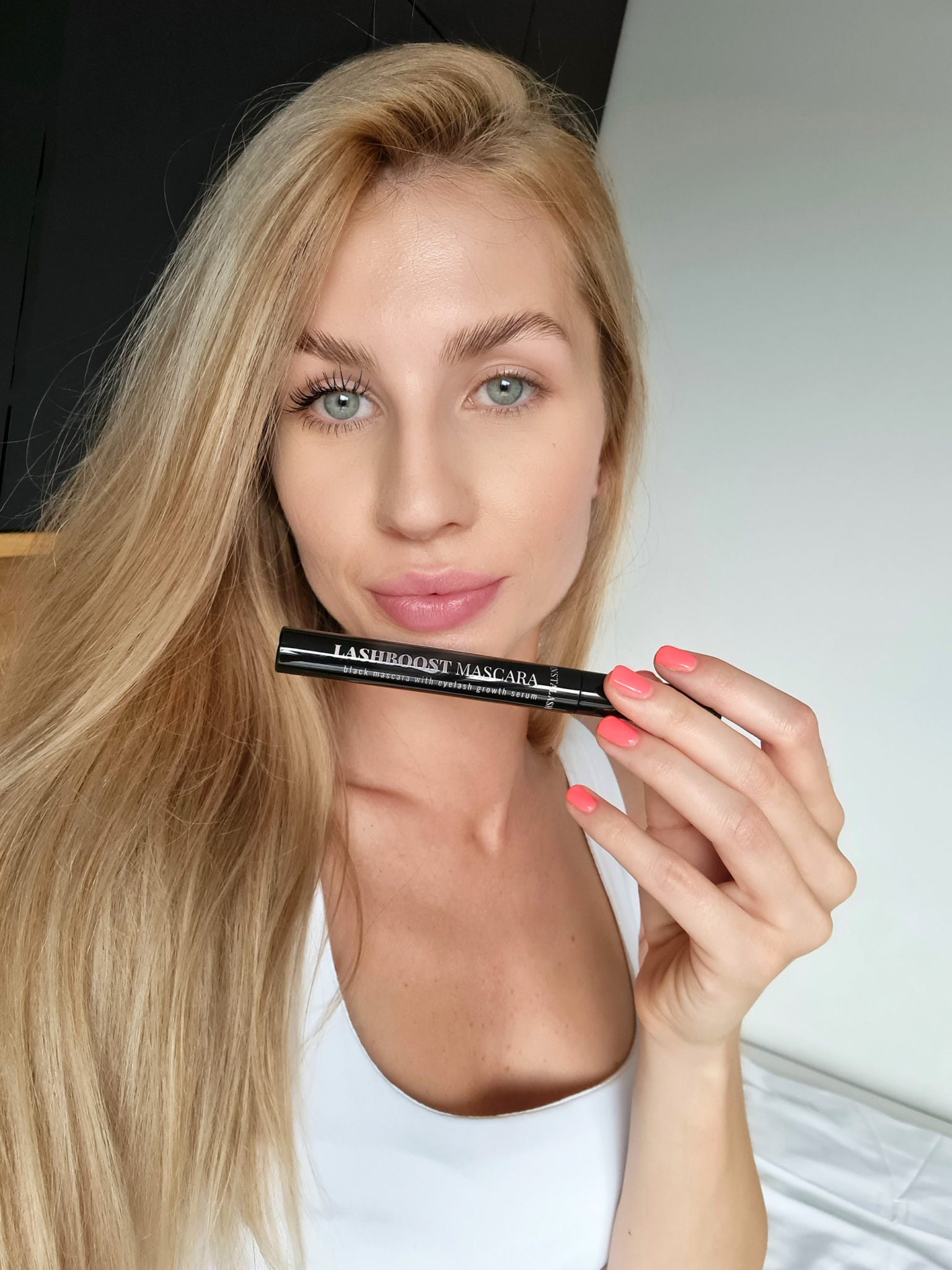 Model holding nstaLash LashBOOST Mascara with Growth Stimulating Serum