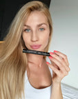 Model holding nstaLash LashBOOST Mascara with Growth Stimulating Serum