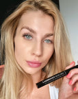 Model holding nstaLash LashBOOST Mascara with Growth Stimulating Serum