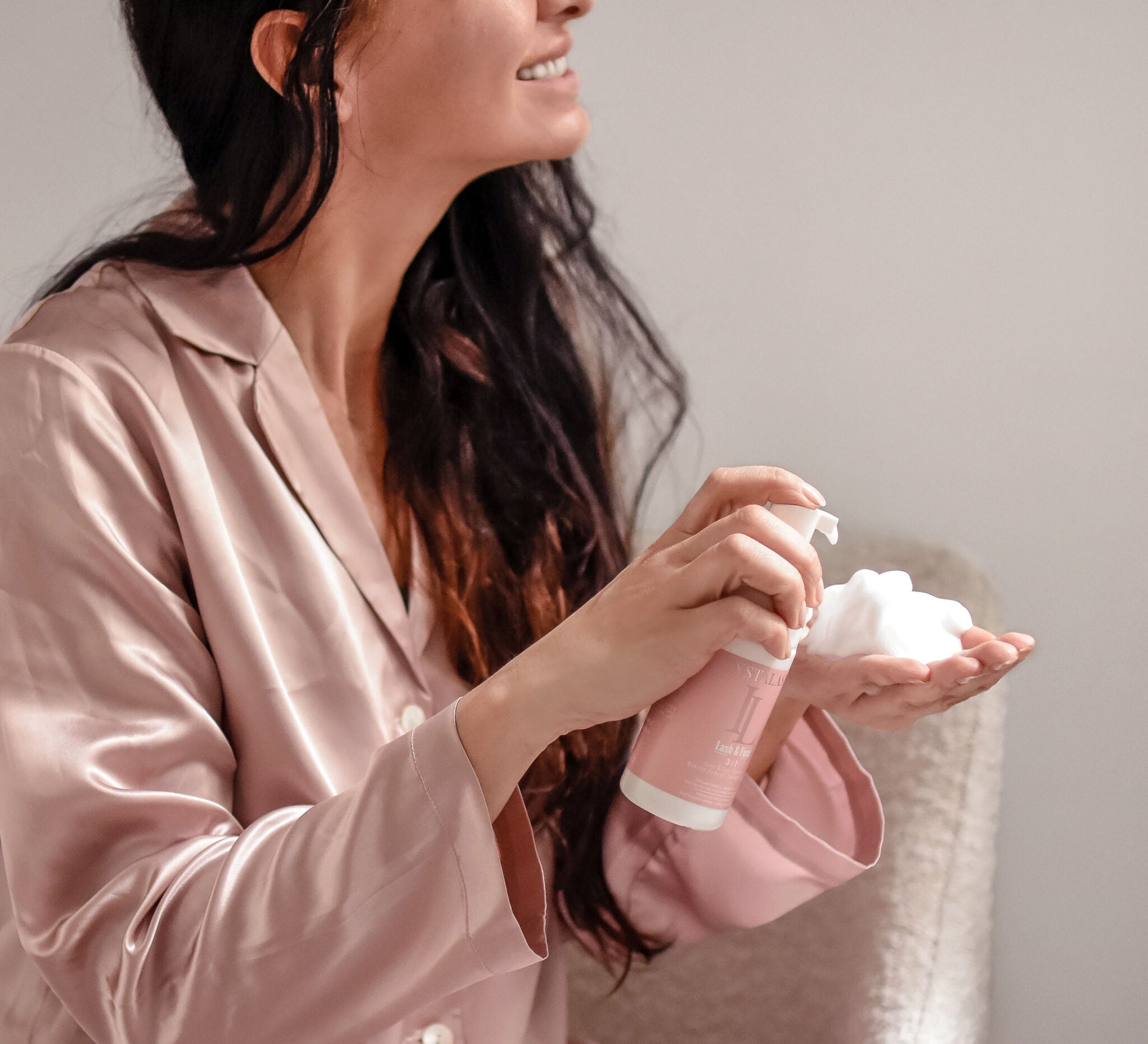 Model using Instalash Lash & Foam Cleansing Foam with Eyelash Conditioner