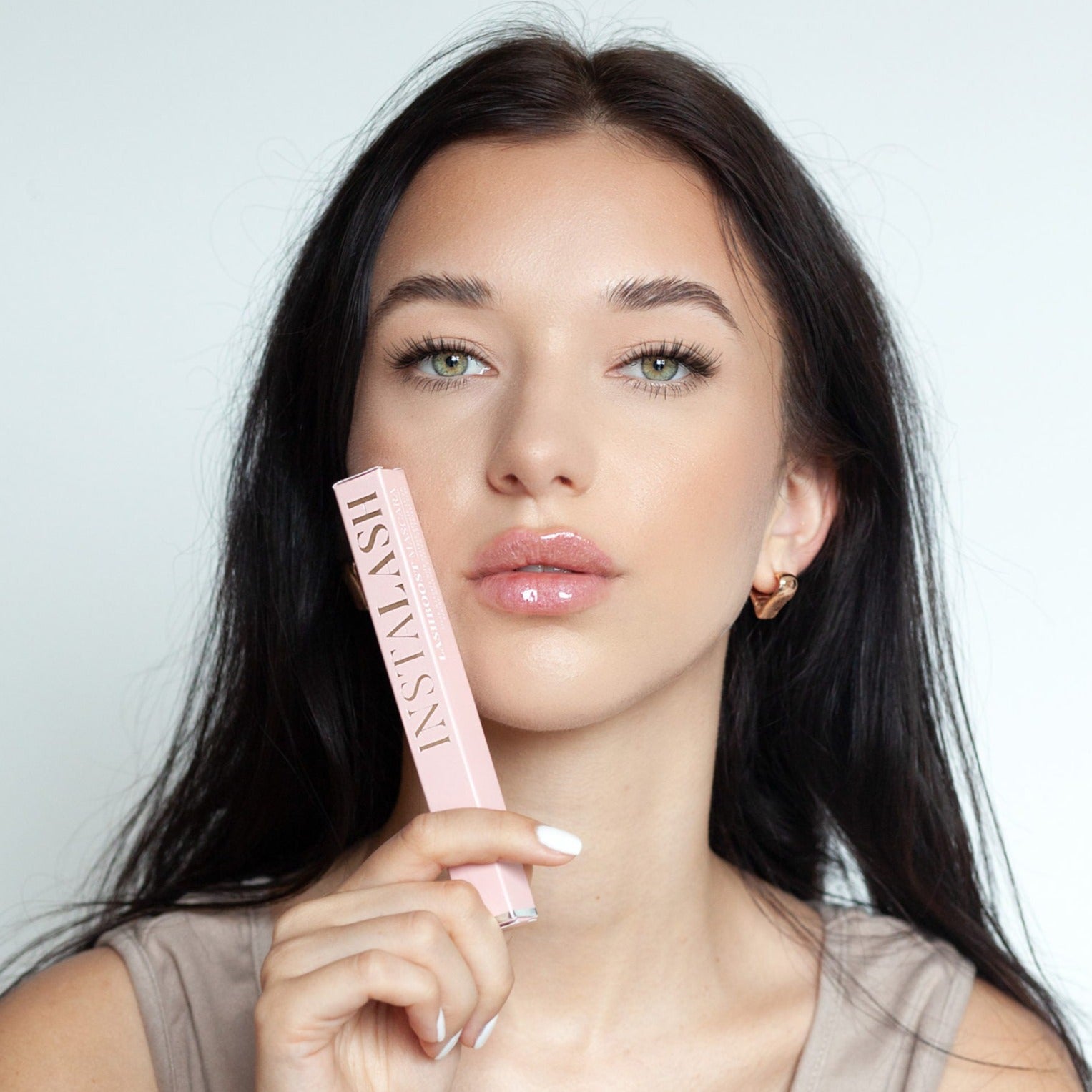 Model holding nstaLash LashBOOST Mascara with Growth Stimulating Serum