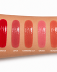 Dominic Paul Lip Glaze swatches on model's arm