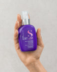 Model holding Alfaparf Milano Semi Di Lino Blonde Anti-Yellow Spray