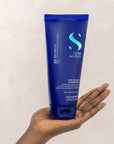 Model holding Alfaparf Milano Semi Di Lino Brunette Anti-Orange Conditioner