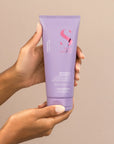 Model holding Alfaparf Milano Semi Di Lino Smooth Smoothing Conditioner