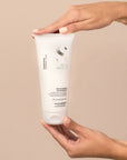 Model holding Alfaparf Milano Semi Di Lino Diamond Illuminating Conditioner 200ml