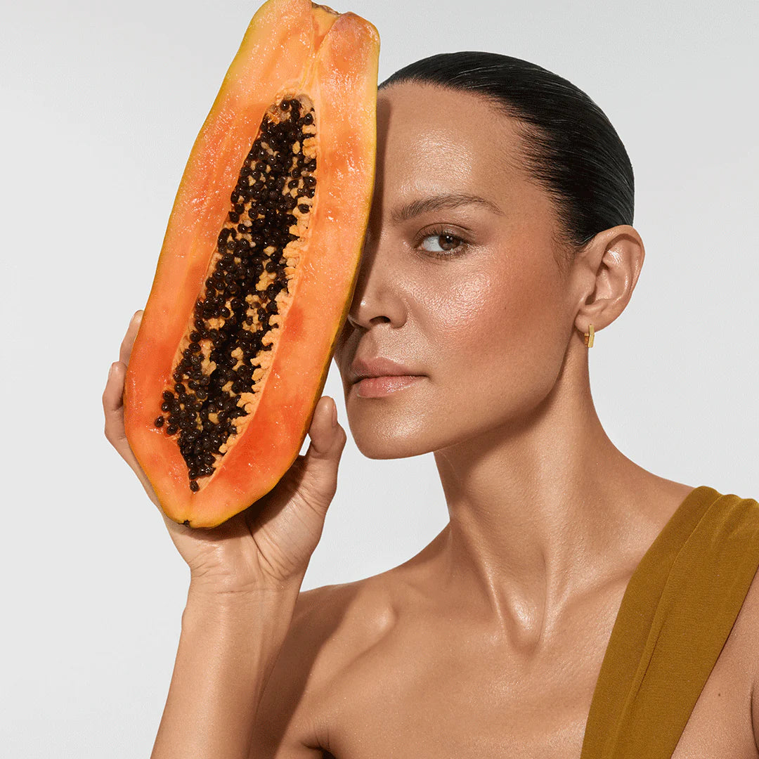 Model holding organic ingredients in Vita Liberata Fabulous Gradual Tanning Lotion formula