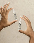 Model holding Alfaparf Milano Semi Di Lino Scalp Renew Energising Lotion