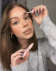 Model applying Instalash LiftBOOST Conditioner – Lash Lifting & Brow Lamination Aftercare