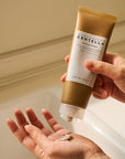 Model applying Skin1004 Centella Ampoule Foam to hand