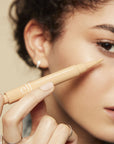 Model using elf Flawless Brightening Concealer