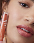 Model using elf Hydrating Core Lip Shine