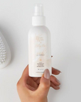 Model holding BEAUTY WORKS X MOLLY-MAE PROTECTIVE UV SPRAY 100ML