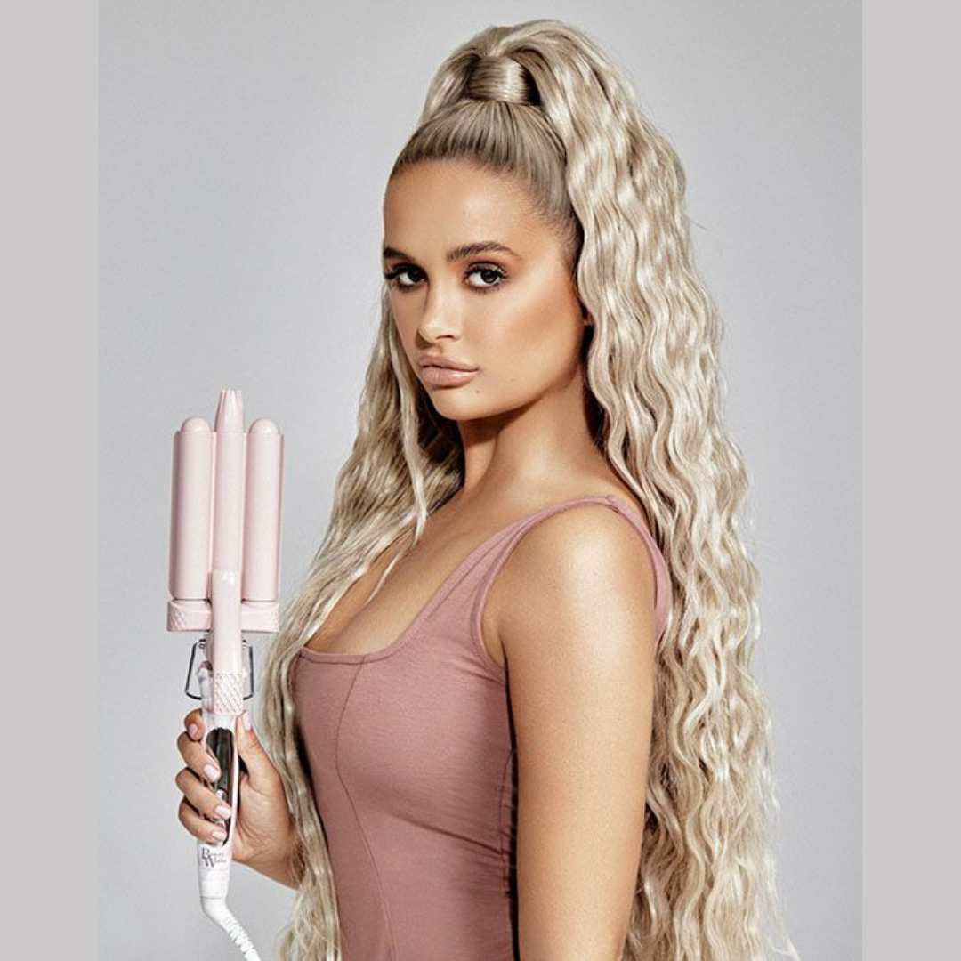 Molly Mae holding Beauty Works X MOLLY-MAE Waver