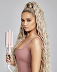 Molly Mae holding Beauty Works X MOLLY-MAE Waver