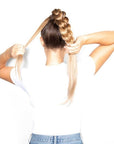 Model installing Beauty Works 24” INSTA BRAID PONYTAIL