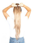 Beauty Works 24” INSTA BRAID PONYTAIL held by model