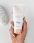 Model holding BEAUTY WORKS X MOLLY-MAE VANILLA GLOSS LOCKS MASK 100ml