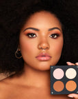 Model holding INGLOT Rosie For Inglot Afterglow Skin Palette - Bronze Glow