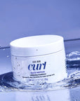 Color Wow Coco-Motion Lubricating Conditioner on water