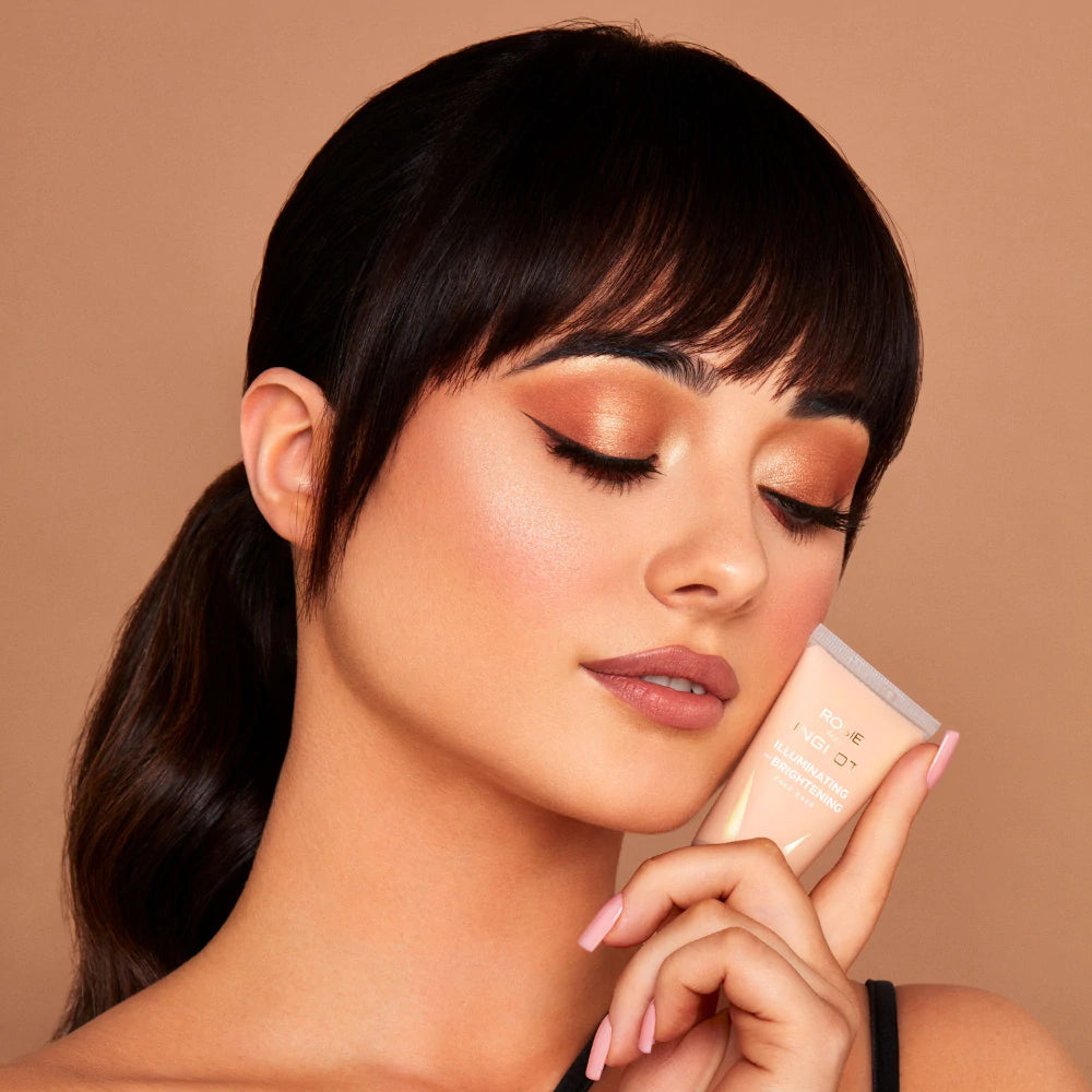 Model wearing INGLOT Rosie For Inglot Illuminating & Brightening Face Base - Honey Glow