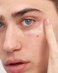 Model using The Inkey List CAFFEINE EYE CREAM