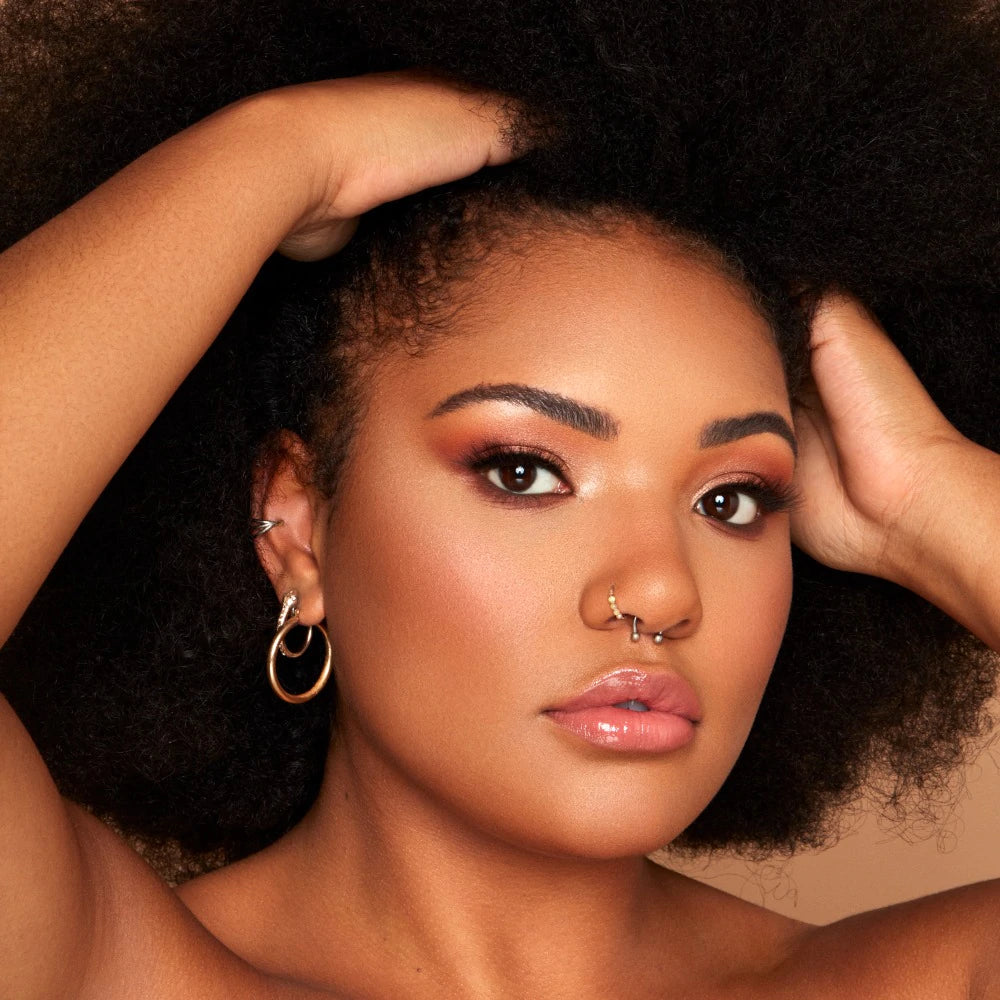Model wearing INGLOT Rosie For Inglot Illuminating & Brightening Face Base - Latte Glow