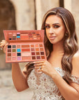 Model holding Mrs Glam Magnificent Palette