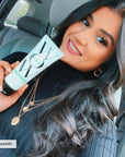 Model holding Color Wow One-Minute Transformation Styling Cream