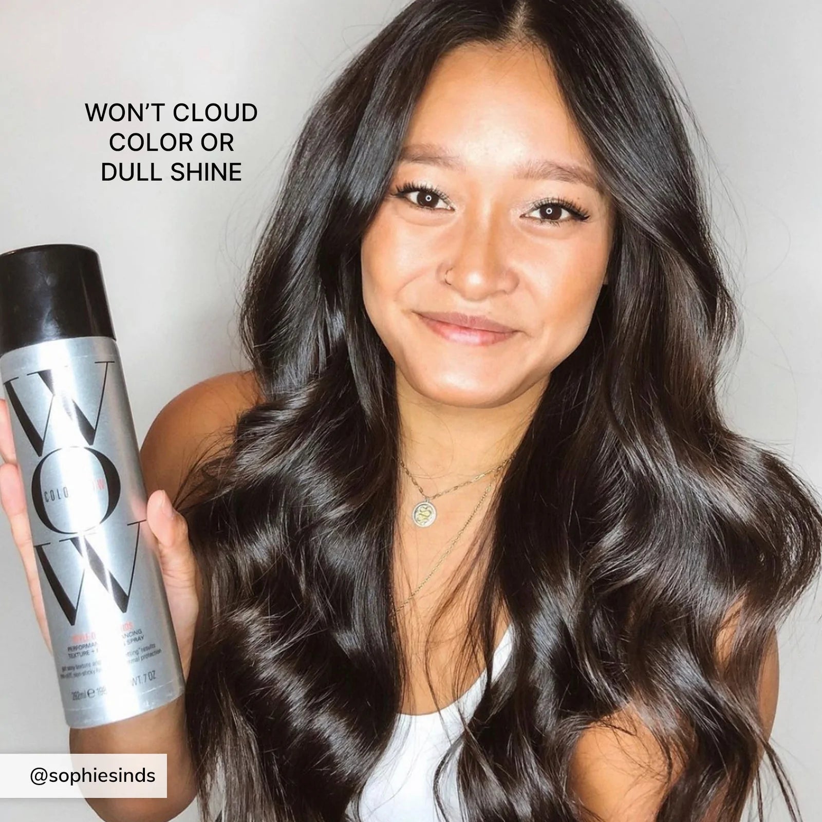 Model holding Color Wow Style on Steroids Color-Safe Texturizing Spray