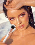 Maura Higgins holding Inglot X Maura Elements Shape and Glow Beauty Brush