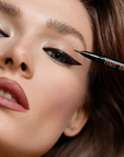 Model using INGLOT One Move Eyeliner Chocolate