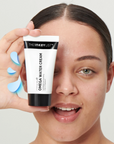 Model holding The Inkey List OMEGA WATER CREAM