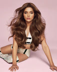Model with hair styled using Color Wow Xtra Large Bombshell Volumizer