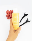 Model holding Beauty Works After Sun Conditioner Treatment 150ml