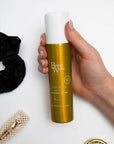 Modeling holding Beauty Works Texturising Spray 100ml