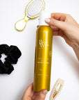 Model holding Beauty Works Texturising Spray 250ml