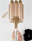 Model holding BEAUTY WORKS Jumbo Waver