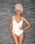 Model holding bPerfect 10 SECOND STRAWBERRY TANNING LOTION – MEDIUM