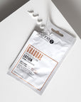 Sienna X Gradual Self Tan Lotion Sachet, open with swatch