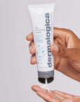 Model holding Dermalogica Skin Smoothing Cream Moisturiser