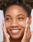 Model applying Dermalogica Skin Smoothing Cream Moisturiser