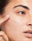 Model applying Dermalogica Skinperfect Pprimer SPF30