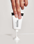 Model holding The Inkey List BAKUCHIOL MOISTURIZER
