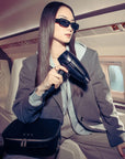 Model traveling with ghd Flight+ Travel Hair Dryer 