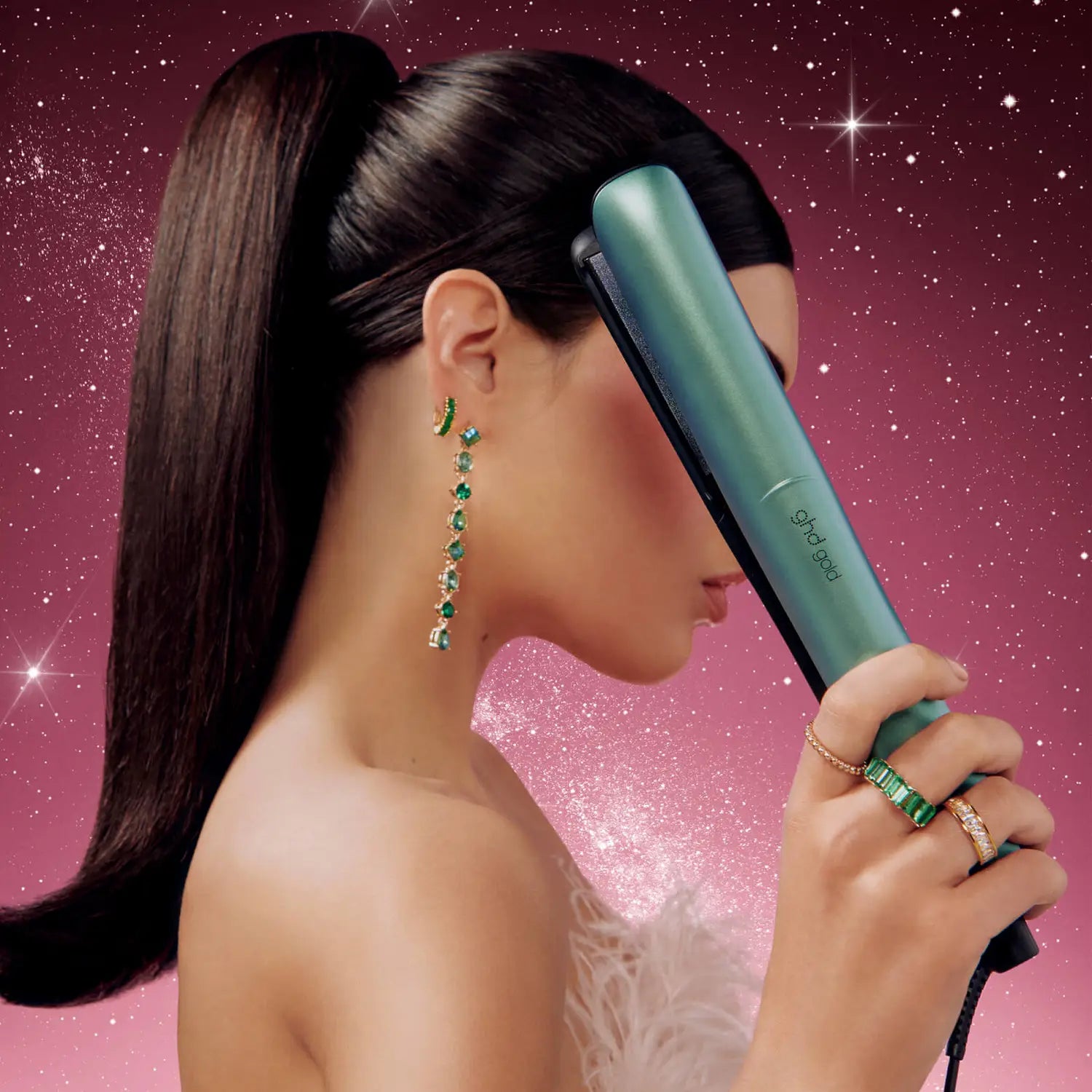 Model holding ghd Gold Hair Straightener In Alluring Jade