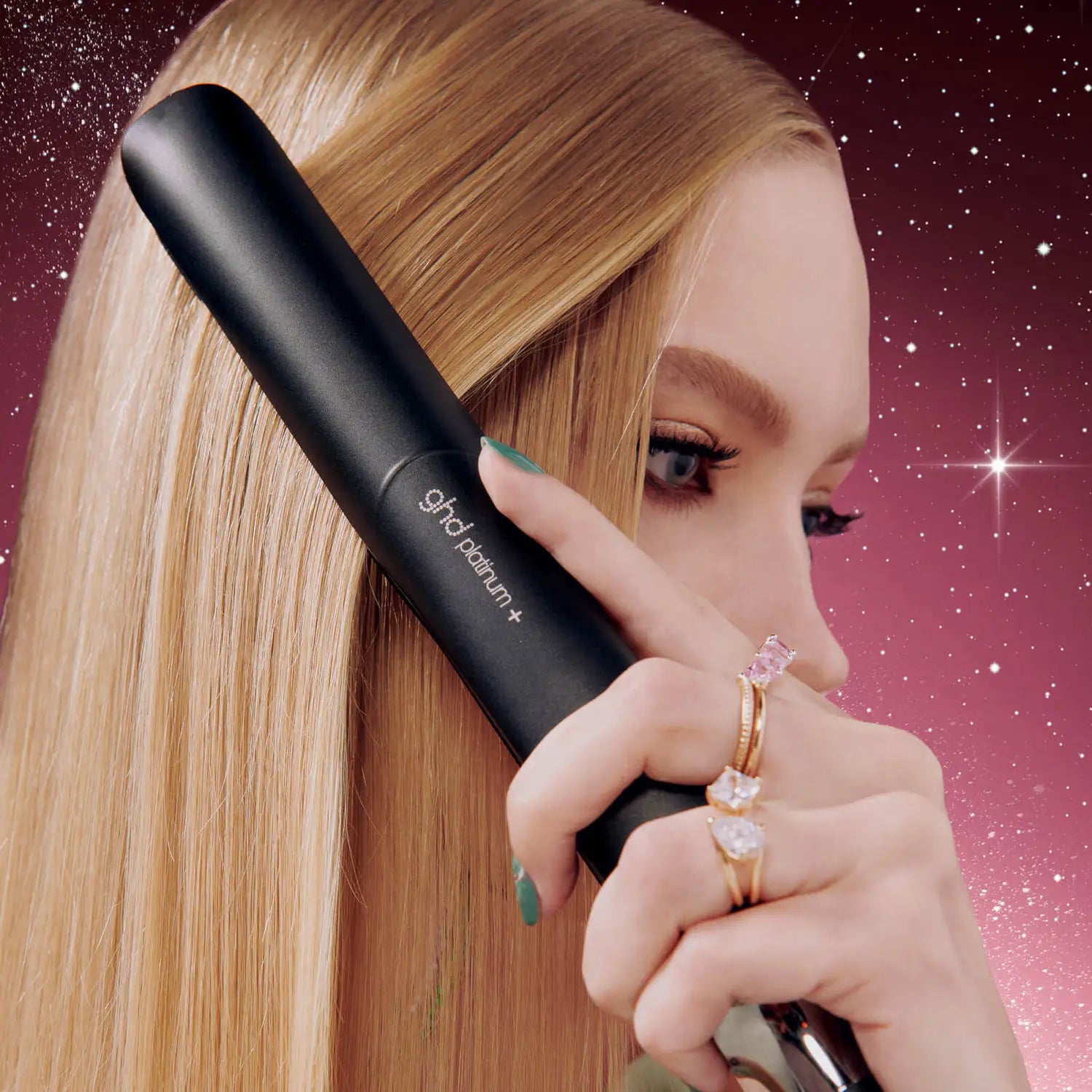 Model styling hair with ghd Platinum+ Festive Gift Set
