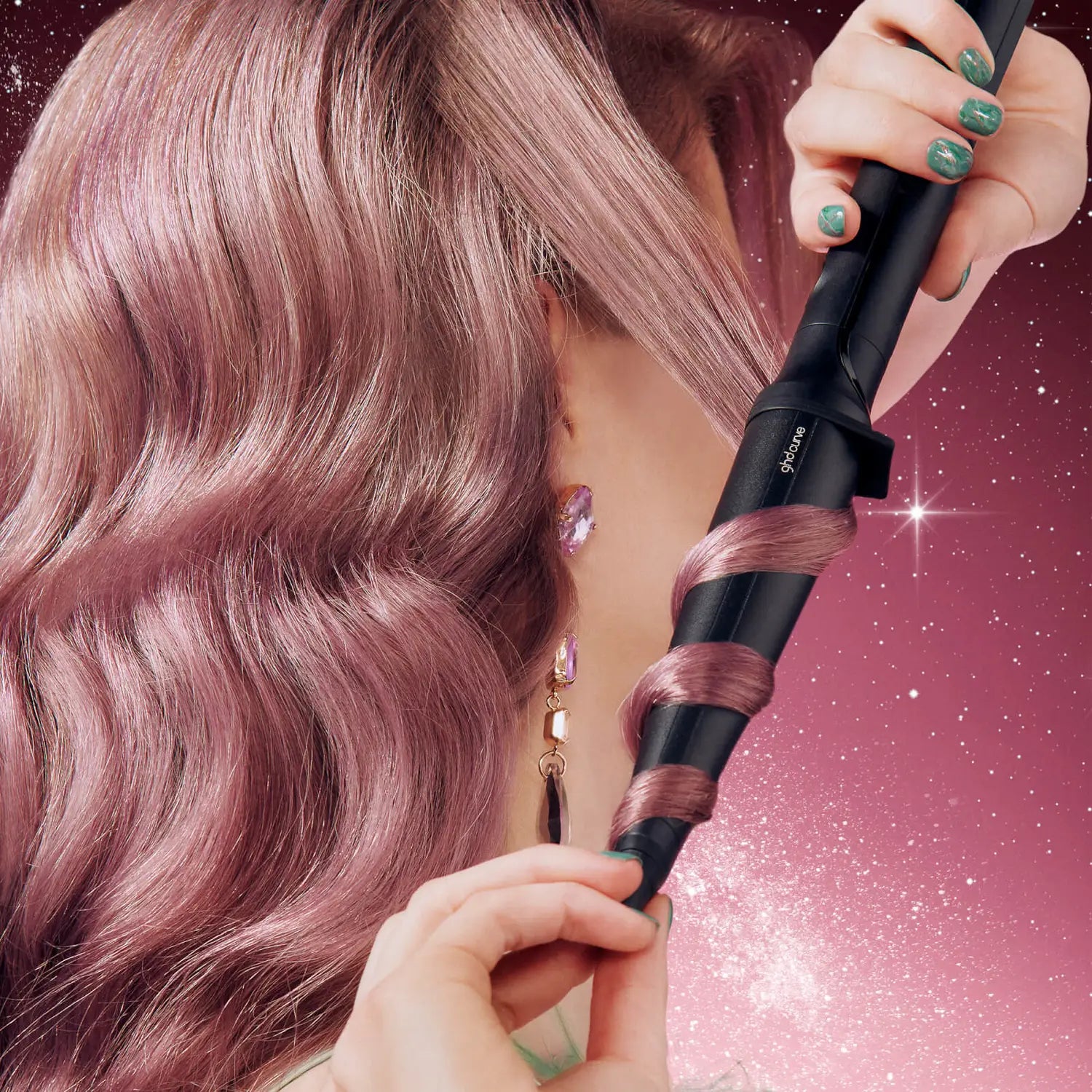 Model styling hair using ghd Curve Creative Curl Wand Christmas Gift Set