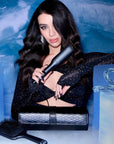 Model holding ghd Max Wide Plate Straightener Gift Set 
